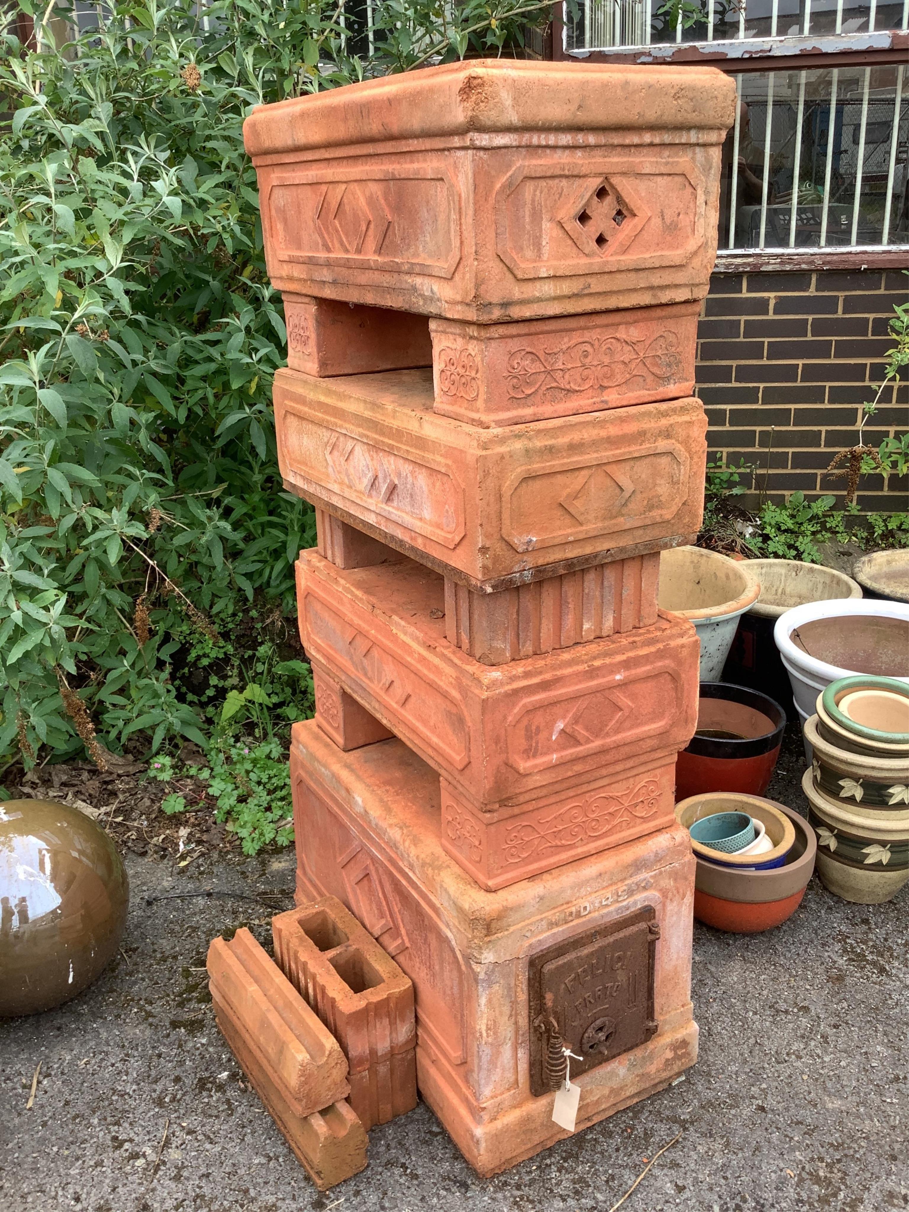 An Italian Felici Prato terracotta sectional garden stove, height 141cm